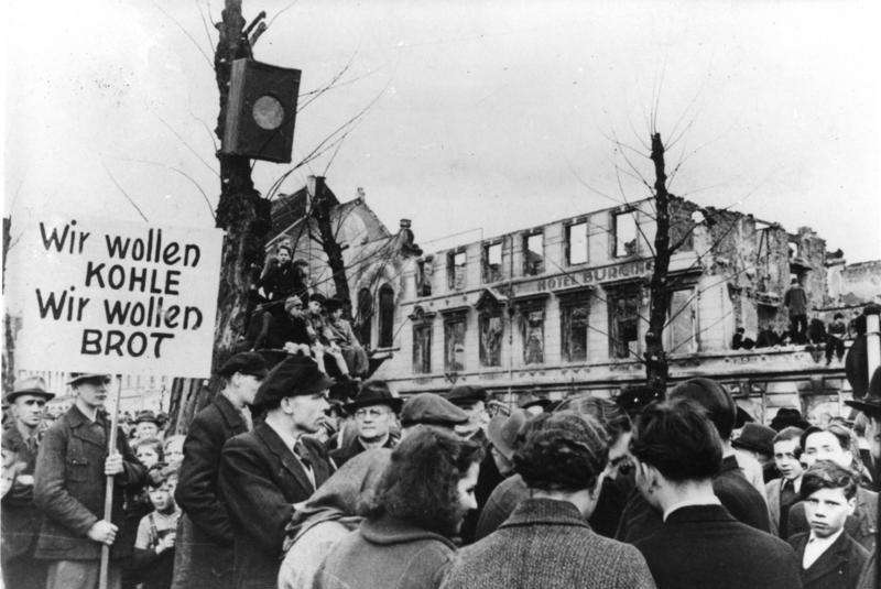 On 31 March 1947, thousands of German workers gathered in Krefeld, West Germany, to protest the catastrophic food shortages suffered as a result of the Second World War. The sign reads: 'We want coal, we want bread'. Courtesy: Wikimedia Commons